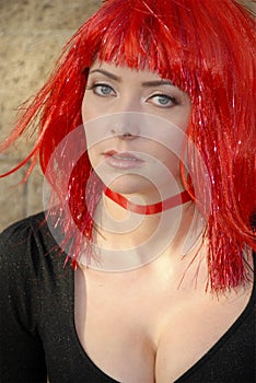 Woman wearing red glitter wig