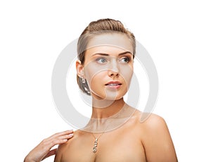 Woman wearing shiny diamond earrings