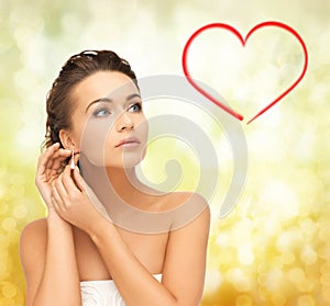 Woman wearing shiny diamond earrings