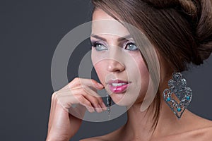 Woman wearing shiny silver earring