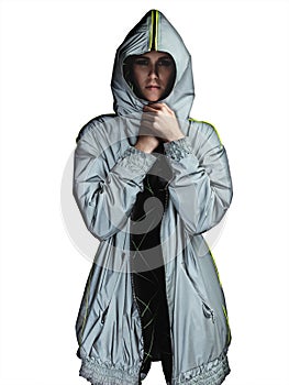Woman wearing a silver futuristic parka on white