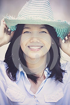 Woman wearing straw hat toothy smiling face happiness emotion