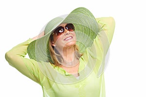 Woman wearing sunglasses and a hat.