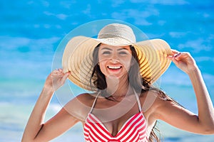 Woman wearing sunhat on beach