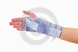 Woman Wearing Supportive Wrist Brace in Studio