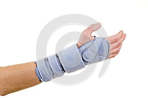 Woman Wearing Supportive Wrist Brace in Studio photo
