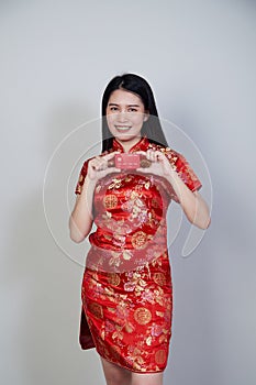 Woman wearing traditional cheongsam qipao dress photo