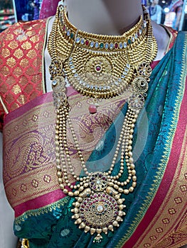 A woman wearing traditional sari with necklace managlsutra jwellery