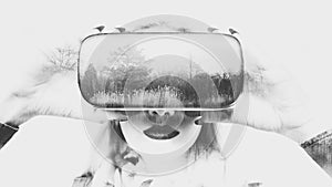 Woman wearing virtual reality glasses. VR headset. Double exposure virtual reality concept.