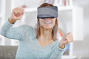 Woman wearing virtual reality headset enjoying new experience