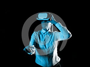 Woman Wearing Vr Glasses And hord Important Messages With one hand. Businesswoman Having Virtual Reality Eyeglasses And photo