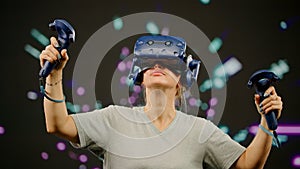 The woman wearing VR headset in virtual reality. The portrait woman in modern virtual reality paint and fly. Screen with