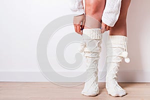 Woman wearing warm socks close-up.