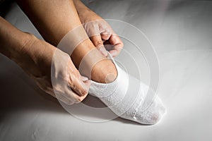 Woman wearing white sock to feet.