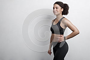 Woman wearing workout clothes with fitness tracker