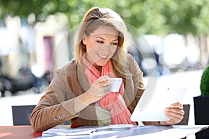 Woman websurfing in coffeeshop photo