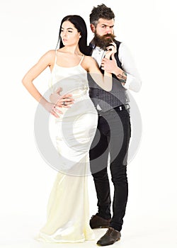 Woman in wedding dress and man in vest. Wedding concept. Couple in love, bride and groom in elegant clothes, white