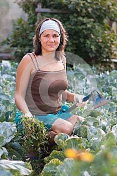 Woman weeding vegetable garden