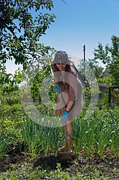 Woman weeding the vegetable garden