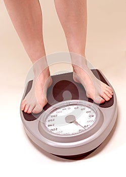 Woman on weighing machine