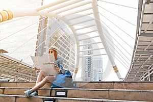 Woman westerner looking at map during city tour in the morning,