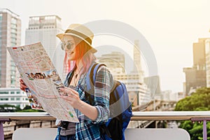 Woman westerner looking at map during city tour in the morning,