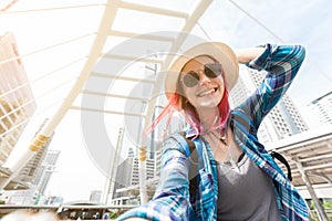 Woman westerner taking selfie during travel in city happy moment photo