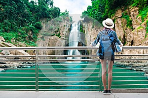 Woman westerner travel in backpack with map looking at Hew Naro photo