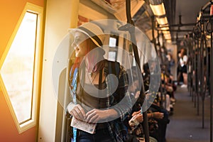 Woman westerner write admire view from train`s window photo