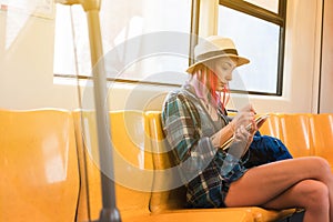 Woman westerner write diary during travel via public train trans photo