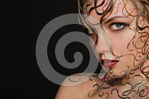 Woman with wet hair and face art