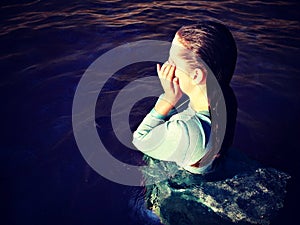 Woman with wet hair in water