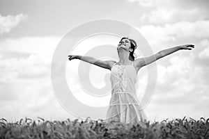 Woman in wheat field, black and white