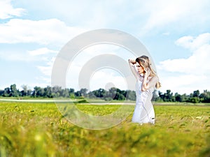 Woman at wheat field on sunny day