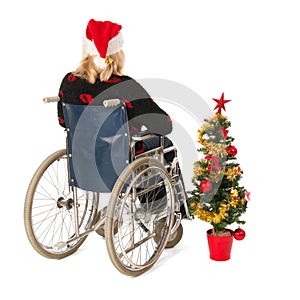 Woman in wheel chair with Christmas tree