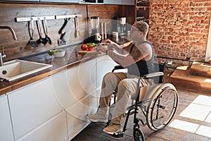 Woman in Wheelchair Cooking