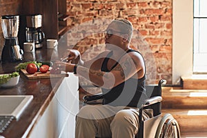 Woman in Wheelchair Cooking at Home