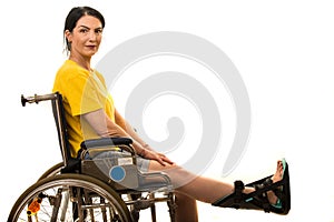 Woman in wheelchair with feet orthosis