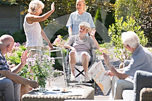 Woman in wheelchair in garden