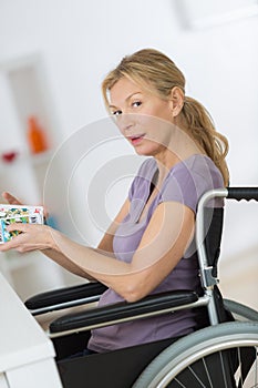 woman in wheelchair at home