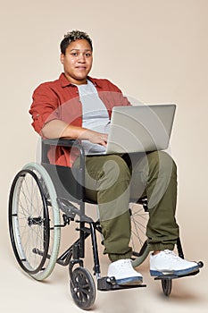 Woman in wheelchair with laptop