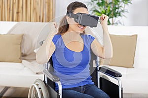 woman in wheelchair playing in virtual reality