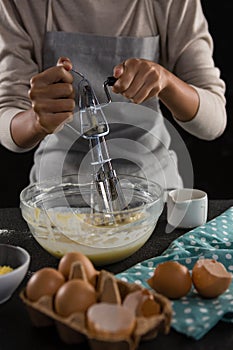 Woman whisking batter in a bowl