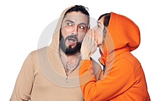 Woman whispering a secret to the man