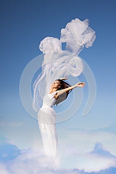Woman in white above the sky