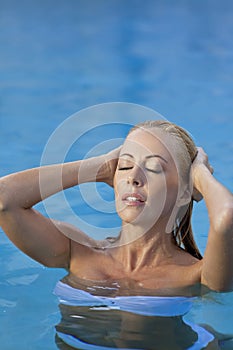 Woman in White Bikini in Swimming Pool