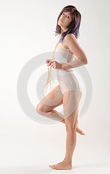 Woman in White Bodysuit and Cross Body Chain