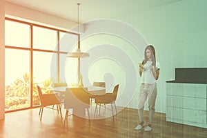 Woman in white dining room corner