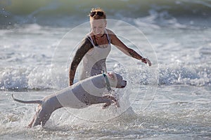 Woman with white Dogo Argentino photo