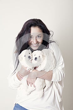 Woman with white dogs